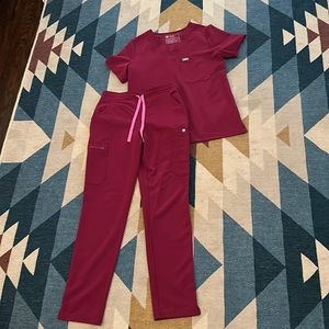 Women’s dark magenta FIGS scrub set.